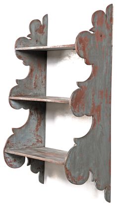 an old metal shelf with two shelves on it