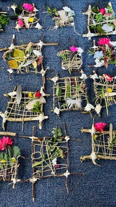 many different types of flowers are placed together on the ground with sticks attached to them