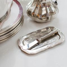 silverware and plates are sitting on a table