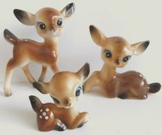 three little deer figurines sitting next to each other