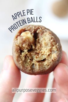 a person holding an apple pie protein ball in their hand with the words, apple pie protein balls