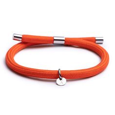 PRICES MAY VARY. Quality - The Orange Nylon Bracelet is made of premium marine graded nylon (high durability and water resistance), and metal parts of our Signature Stainless Steel with a polished finish. Recycled Nylon - The nylon is knitted with 100% recycled materials to make it a better choice for the environment. One Size - The design of the bracelet makes it fully adjustable and fits wrist between 5.5-8.3 inches. Handmade - All Alton of Sweden jewelry is handcrafted to ensure that every de Nylon Bracelet, Paracord Armband, Wearables Design, Surfer Bracelets, Wrist Game, Paracord Bracelet, Paracord Bracelets, Bracelet For Men, Exclusive Jewelry