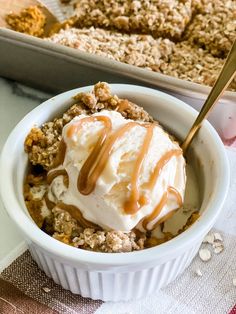 a white bowl filled with ice cream and granola