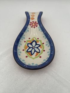 a blue and white vase sitting on top of a table