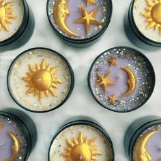 there are six candles with gold stars and moon designs on them in the shape of sun and moon