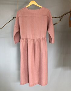 "Made from medium weight linen, this dress is very soft and swings comfortably, allowing movement in all the right places. Buttoned front and loose fit design, it will be a staple in your wardrobe for a long time to come. -100% linen construction -Below the knee length (or to be customized per request) -3/4 sleeves ( or to be customized per request) -Half front closure with buttons -Gathered waist -Two side pockets - Listing Colors: Grayish Blue, Blush, Amber, Teal Please provide your shoulder w Linen Midi Dress For Daywear, Spring Linen Buttoned Dress, Linen A-line Midi Dress For Daywear, Linen Midi Dress With Buttons, Linen Midi Dress With Relaxed Fit, Relaxed Fit Linen Maxi Midi Dress, Mid-length Linen Dress For Spring, Buttoned Midi Linen Dress, Linen Midi Dress With Buttons For Daywear