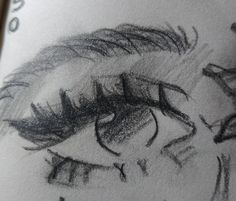 a drawing of a woman's eye with black and white pencils on paper