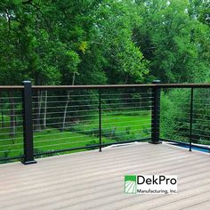 a wooden deck with black rails and railings