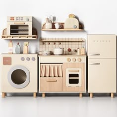 a toy kitchen set with an oven, stove and microwave