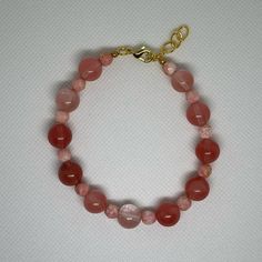 Handmade 7 In Gold Wire Bracelet With A 1 In Extender Featuring Round Cherry Quartz And Smaller Gold Iridescent Gemstone Beads! Iridescent Gemstone, Cherry Quartz, Quartz Beads, Wire Bracelet, Quartz Bracelet, Handmade Gold, Gold Wire, Jewelry Handmade, Womens Jewelry Bracelets