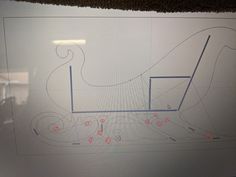 a drawing of a horse drawn carriage on a sheet of paper with red dots around it