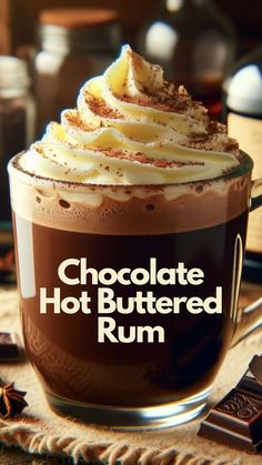 chocolate hot buttered run in a glass mug with whipped cream and caramel garnish