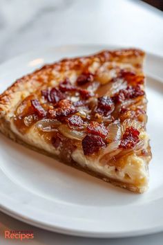 a slice of pizza sitting on top of a white plate