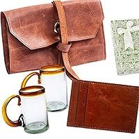 two glasses and a wallet are sitting next to each other