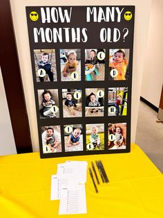 a yellow table topped with pictures next to a black and white sign that says how many months old?