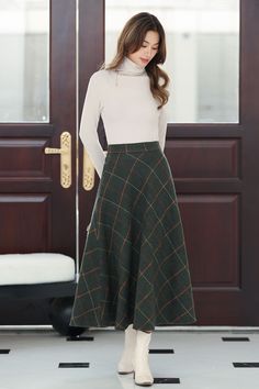 "This winter wool skirt is a classic piece of tailoring that will see you through rain or shine. It is cut with a flattering flared skirt to give you a wonderful shape. The winter skirt is perfect classic styling and ends at the ankle. This is a versatile skirt that you'll wear again and again. DETAILS: * 30% wool, 30% fiber, 40% polyester * fully satiny liner * Two side pockets * Right zip closure * Elastic band at the back to provide some stretch * Plus size skirt * Midi wool skirt * Perfect for Winter, autumn * Lean More about the items From the FAQs on the page bottom * The model is 170 cm (5′ 7″) tall with a 80 cm (31.5\") bust, 66 cm (26\") waist. She is wearing the plaid wool skirt in size XS. CUSTOM MADE SERVICE If you * Change other color * Can't find your size in our size Chart * Classic Skirts Outfits, Winter Wool Skirt, Midi Wool Skirt, Midi Rock Outfit, A Line Skirt Midi, Green Plaid Skirt, A Line Midi Skirt, Wool Stockings, Green Midi Skirt