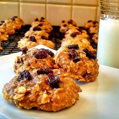 cookies and milk sitting on a counter next to a glass of milk