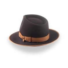 Description Materials Craftsmanship Hat Care Shipping Returns Product Description A Chocolaty Style Statement with a Teardrop Crown Immerse yourself in the rich tones of The Caesar, a luxurious teardrop fedora hat crafted from premium chocolate brown beaver fur felt. Radiating understated elegance, this hat is a perfect alignment with your distinctive style. Handcrafted with meticulous attention to detail, each stitch and fold reflects the artistry behind our custom handmade hats. The Caesar's w Homburg Hat, Outdoor Hut, Gambler Hat, The Raid, Mens Hats Fashion, Fedora Hat Men, Homburg, Chapeau Cowboy, Trilby Hat