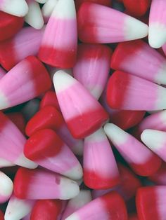 red and white candy canes are piled together