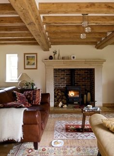 a living room filled with furniture and a fire place