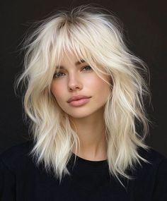 The classic messy platinum blonde shag is perfect for adding texture and volume to fine hair. The layers create a tousled, carefree look, while the platinum blonde color adds a modern and edgy twist. Platinum Blonde Brown Eyes, Blonde Hair Alternative, Fine Hair Shag Haircut, Blonde Shag With Bangs, Platinum Blonde Hair With Bangs, Blonde Wolf Cut Short, Blond Shag, Hair Color Ideas Platinum Blonde, Platinum Blonde Shag