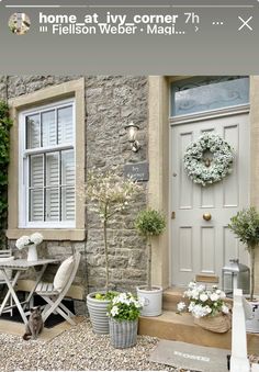 an image of a front porch with flowers and potted plants