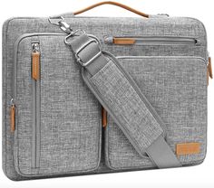 a gray laptop bag with brown straps