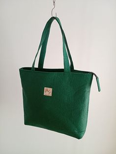 Pinatex Green Tote Bag! Portuguese Handcrafted pinatex tote bag, veagan leather Tote Bag. This tote bag was made in Portugal with sustainable materials, in the exterior there is pinatex leather and organic cotton in the interior. If you need with another dimensions or colors, please tell me. Size: Height - 33 cm /13 inch width - 42 cm/16.5 inches depth- 8.5 cm / 3.5 inch Shoulder Strap - 55.5 cm / 22 inches Follow us on instagram @bymartacoelho School Computers, Green Tote Bag, Vegan Leather Tote Bag, Green Tote, Vegan Leather Tote, Computer Bag, Computer Bags, Shoulder Tote Bag, Sustainable Materials