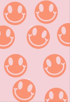 an orange smiley face pattern on a pink background