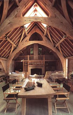 the inside of a large wooden building with high vaulted ceilings