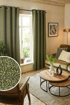 a living room filled with furniture and a window covered in green drapes, next to a coffee table