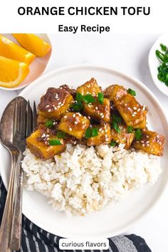 a white plate topped with rice and chicken