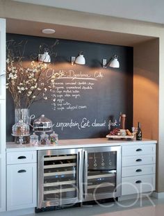 a chalkboard with writing on it in a kitchen