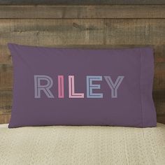 a pillow with the word riley on it