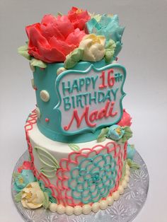 a birthday cake decorated with flowers and icing