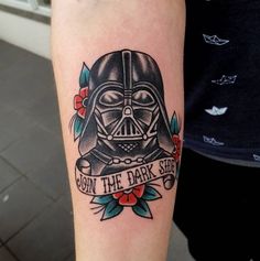 a tattoo on the arm of a person with a darth vader helmet