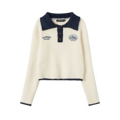 Holding the essence of vintage varsity fashion, this sweater combines nostalgic charm with modern sophistication. The crisp, ivory hue is beautifully contrasted by the navy blue accents on the plush collar and cuffs, while the textured knit provides a cozy yet lightweight feel. The patch emblem and contrasting buttons add a preppy touch, making it a standout piece in any wardrobe. This jacket is a versatile garment that pairs seamlessly with both casual jeans and tailored trousers. Its cropped s Navy Winter College Sweater, Navy Winter Sweater For College, Preppy College Sweater For Winter, Preppy Winter Sweater With Ribbed Collar, Casual Fall Sweater With Contrast Trim, Casual Sweater With Contrast Trim For Fall, Winter Long Sleeve Tops With Contrast Trim, Fall Cream Polo Sweater With Ribbed Collar, Casual Winter Sweater With Contrast Trim