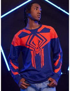 A new Spidey is in town! Swing into the Lobby to meet Miguel O'Hara with this long-sleeve from Spider-Man: Across the Spider-Verse! Featuring a blue and red printed design inspired by Spider-Man 2099's costume. Spider Man Tree Topper, Spiderman Homemade Suit Art, Spider Man Wreaths, Spider Man Themed Christmas Tree, Spiderman Christmas Wreath, Spiderman Yarn Bracelet, Spiderverse Fanart, Spiderman Across The Spider Verse, Spider Man 2099