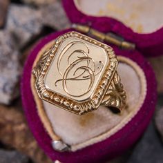 This antique signet ring features the initials "OO" in script on the rectangular shaped top. The shoulders are decorated with beautiful scrolling and patina. The ring is crafted in 14k yellow gold and is a size 10.5. We are not offering resizing due to the hand engraved inscription on the inside if the shank that reads "Minnie Fira Reidar de Wenke." Luxury Antique Signet Ring With Brilliant Cut, Luxury Vintage Diamond Cut Signet Ring, Luxury Engraved Victorian Signet Ring, Classic Engraved Signet Ring For Ceremonial Occasions, Classic Collectible Signet Ring With Engraving, Classic Engraved Signet Ring For Ceremonial Use, Classic Engraved Ceremonial Signet Ring, Antique Initial Ring In 14k Gold, 14k Gold Engraved Signet Ring Collectible