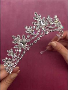 Crystal Bridal Tiara ho3441 You'll feel like royalty while wearing this artistic tiara by Dareth Colburn. The elegant multi-peak silver plated crown sparkles with emerald, marquise and round crystals for sparkle from every angle. Pin loops at the end allow for securing it in your hairstyle. This headpiece will be the perfect accessory for your elegant wedding day or quinceanera. Size: Design is about 1 3/4" inches tall at the center peak. Color: Silver. Style: hp3441. Just beautiful! Products by Beaded Edge Veil, Winter Wedding Accessories, Gold Bridesmaid Jewelry, Crystal Wedding Tiaras, Rose Gold Tiara, Veil Accessories, Crystal Bridal Tiaras, Pearl Tiara, Gold Bridesmaids