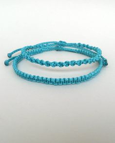 "Turquoise Macrame bracelets for him and her These handknotted bracelets are made with durable turquoise waxed string. They are adjustable and have a sliding knot closure in order to fit a lot of sizes. Due to their waxed threads,the bracelets are very durable and water resistant. Width: 0.4cm / 0.15\" The price is for 1 bracelet. More surf bracelets: https://www.etsy.com/shop/LuckyRatJewellery?section_id=18893646&ref=shopsection_leftnav_2shopsection_leftnav_2 Other bracelets in my shop: https:/ Rat Jewellery, Surf Bracelets, Bracelets For Him, Sliding Knot Closure, Men Bracelets, Surfer Bracelets, Friendship Jewelry, Bracelet Friendship, Bracelet Men