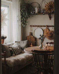 a living room filled with furniture next to a window