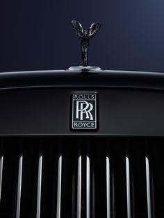 rolls royce logo on the hood of a black car