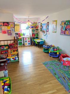 a child's playroom with toys on the floor