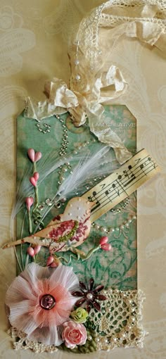 a piece of paper with flowers and music notes on it, sitting next to a lace doily