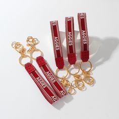 Maroon keychain with white letters: AGGIES **official Texas A&M licensee Casual White Keychain With Key Leash, Casual White Keychains With Key Leash, Texas A&m, White Letters, Magnolia, Keychains, Beauty Book, Texas, Accessory Gift