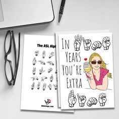 two greeting cards with the words in years you're extra on them next to a computer keyboard