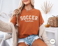 Soccer Mama Shirt, Comfort Colors Soccer Mom T-shirt, Soccer Mom Gifts, Sports Mom Tee, Game Day Shirt, Soccer Season UNISEX T-SHIRTS Comfort Colors Unisex T-shirt - 100% ring-spun cotton (fiber content may vary for different colors) - Medium fabric - Relaxed fit SIZING AND COLORS - Please refer to the size chart in the listing photos for detailed sizing information - For an oversized look, we recommend sizing up two sizes - All products are true-to-fit unisex sizing SHIPPING AND PRODUCTION TIME - Production: 1-3 days - Standard Shipping: 3-5 business days after production time HOW TO ORDER - Choose your shirt color - Choose your size - Verify all order information is correct CARE INSTRUCTIONS - To preserve the design, wash inside out with warm water and mild detergent - Do not dry shirts Soccer Mom Gifts, Soccer Season, Game Day Shirts, Soccer Mom, Sports Mom, Mom Gifts, Mom Tees, Mama Shirt, Shirt Color