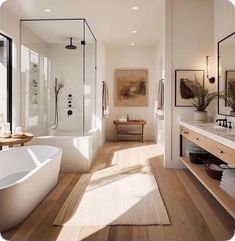 a bathroom with a tub, sink and large mirror on the wall next to it