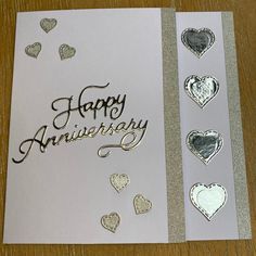 two greeting cards with hearts and the words happy anniversary